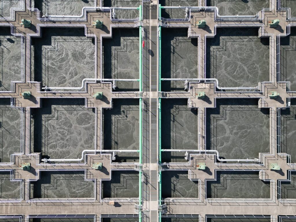 pexels-photo-35425761 Aerial shot of a water treatment plant showing complex industrial design.