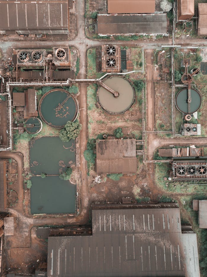 pexels-photo-4741970 From above aerial view of industrial area of sewage treatment plant with round shaped water clarifiers